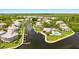 Aerial view of waterfront community with private docks and resort-style amenities at 13065 Via Aurelia, Placida, FL 33946