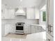 White kitchen features stainless steel appliances and ample cabinetry at 13065 Via Aurelia, Placida, FL 33946
