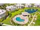 Kidney-shaped community pool with surrounding lounge chairs and gazebo at 13065 Via Aurelia, Placida, FL 33946