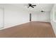 Spacious common area with hardwood floors and ceiling fans at 13065 Via Aurelia, Placida, FL 33946