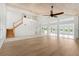 Spacious living room with vaulted ceilings, hardwood floors, and a fireplace at 13065 Via Aurelia, Placida, FL 33946