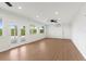 Bright Gathering room featuring hardwood floors and sliding glass doors to a patio at 13065 Via Aurelia, Placida, FL 33946