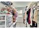 Large walk-in closet with shelving and hanging rods at 12730 Lemon Pepper Dr, Riverview, FL 33578