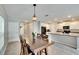 Kitchen features a dining area with a wood table and four chairs at 12730 Lemon Pepper Dr, Riverview, FL 33578