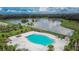 Community pool area with lounge chairs and landscaping at 12730 Lemon Pepper Dr, Riverview, FL 33578
