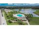 Community pool and clubhouse with surrounding landscape at 12730 Lemon Pepper Dr, Riverview, FL 33578