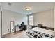 Spacious bedroom with a bed, desk, and mirror at 12730 Lemon Pepper Dr, Riverview, FL 33578