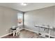 Bedroom with sewing station and window at 12730 Lemon Pepper Dr, Riverview, FL 33578