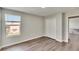 Bedroom with window showing backyard view and double doors to closet at 12730 Lemon Pepper Dr, Riverview, FL 33578