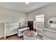 Bedroom with various dressers and a round wooden table at 12730 Lemon Pepper Dr, Riverview, FL 33578
