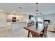 Open concept dining area with kitchen views and pendant lighting at 12730 Lemon Pepper Dr, Riverview, FL 33578