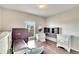 Bedroom with multiple dressers and a round wooden table at 12730 Lemon Pepper Dr, Riverview, FL 33578