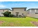 Grass lawn, fenced backyard, garden area at 12730 Lemon Pepper Dr, Riverview, FL 33578
