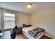 Small bedroom with a bed and a desk at 12730 Lemon Pepper Dr, Riverview, FL 33578