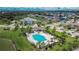 Community pool and surrounding area, near pond at 12730 Lemon Pepper Dr, Riverview, FL 33578