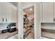 Well-organized pantry with ample shelving for storage at 12730 Lemon Pepper Dr, Riverview, FL 33578