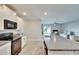 Modern kitchen with stainless steel appliances and granite countertops at 12730 Lemon Pepper Dr, Riverview, FL 33578