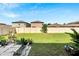 Grass backyard with patio and wooden fence at 12730 Lemon Pepper Dr, Riverview, FL 33578