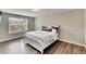 Bright bedroom with large window and wood flooring at 12730 Lemon Pepper Dr, Riverview, FL 33578