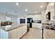 Kitchen boasting white cabinets, granite countertops and island at 12730 Lemon Pepper Dr, Riverview, FL 33578