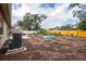 Backyard view, showing AC unit and garden at 739 Isleton Dr, Brandon, FL 33511