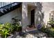 Exterior view of condo building showcasing landscaping and entrance at 4837 Puritan Cir # 2505, Tampa, FL 33617