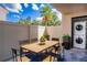Outdoor patio with a wood dining table and seating for six at 4837 Puritan Cir # 2505, Tampa, FL 33617