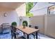 Relaxing patio features a wood dining table and grill at 4837 Puritan Cir # 2505, Tampa, FL 33617