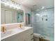Updated bathroom with dual sinks, marble shower, and modern fixtures at 4837 Puritan Cir # 2505, Tampa, FL 33617