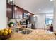 Updated kitchen with granite countertops and stainless steel appliances at 4837 Puritan Cir # 2505, Tampa, FL 33617