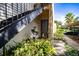 Exterior view showing building entrance and landscaping at 4837 Puritan Cir # 2505, Tampa, FL 33617