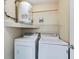 Laundry closet with washer, dryer and water heater at 2595 Countryside Blvd # 8106, Clearwater, FL 33761