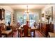 Formal dining room with hardwood floors and large windows at 1479 S Evergreen Ave, Clearwater, FL 33756