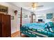 Bedroom with hardwood floors, a four-poster bed, and large windows at 1479 S Evergreen Ave, Clearwater, FL 33756