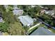Aerial view showcasing the home's backyard, surrounded by trees and a fence at 1479 S Evergreen Ave, Clearwater, FL 33756