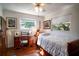 Cozy bedroom with hardwood floors and a wooden bed frame at 1479 S Evergreen Ave, Clearwater, FL 33756