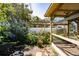 Backyard features a pergola, garden, and seating area at 1479 S Evergreen Ave, Clearwater, FL 33756