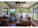 Sunroom with wooden table and chairs, large windows at 1479 S Evergreen Ave, Clearwater, FL 33756