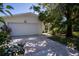 White two-car garage with a spacious driveway at 1479 S Evergreen Ave, Clearwater, FL 33756