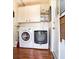 Laundry room with washer, dryer and storage cabinets at 1479 S Evergreen Ave, Clearwater, FL 33756