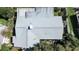 Top-down view of the house, highlighting the gray roof and the surrounding landscape at 1479 S Evergreen Ave, Clearwater, FL 33756