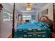 Main bedroom with hardwood floors, a four-poster bed, and large windows at 1479 S Evergreen Ave, Clearwater, FL 33756