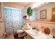 Clean bathroom with pink tile, a shower, and a vanity at 1479 S Evergreen Ave, Clearwater, FL 33756