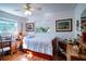 Bright bedroom with hardwood floors, twin bed and wooden dresser at 1479 S Evergreen Ave, Clearwater, FL 33756