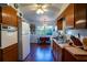 Kitchen boasts wood cabinets and white appliances at 1479 S Evergreen Ave, Clearwater, FL 33756