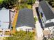 Aerial view of the property displaying its well-kept lawn, roof, and convenient driveway access at 2335 W Beach St, Tampa, FL 33607