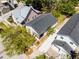 Aerial view of the home showcasing its proximity to other homes, driveway, and well-maintained landscaping at 2335 W Beach St, Tampa, FL 33607