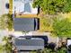 Aerial view of the property with a well-maintained roof, landscaping, and driveway in a residential neighborhood at 2335 W Beach St, Tampa, FL 33607