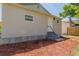 Landscaped backyard with wood chips and a wooden fence at 2335 W Beach St, Tampa, FL 33607