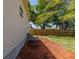 Side yard with mulch and a wooden privacy fence at 2335 W Beach St, Tampa, FL 33607